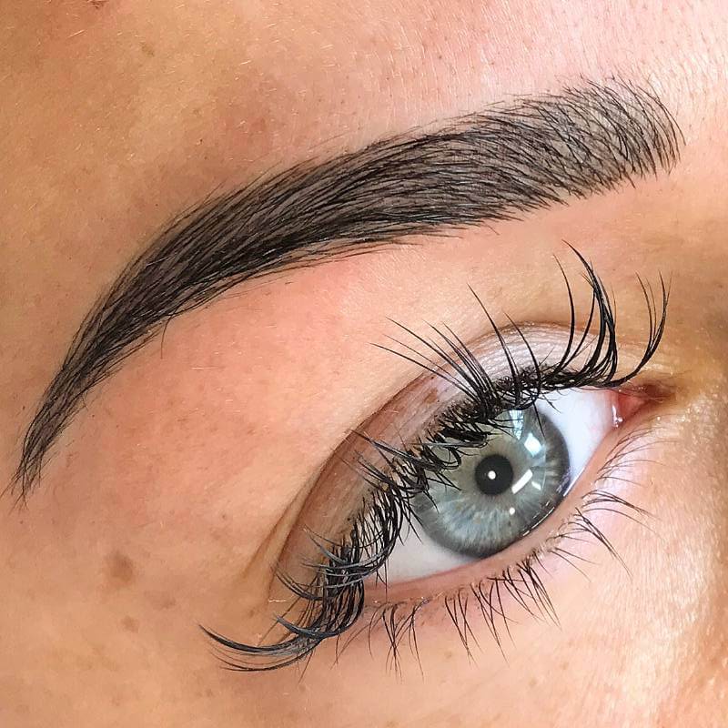 A close up example of a microblade tattoo eyebrow